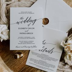 the wedding stationery is laid out on top of an envelope with a wax stamp