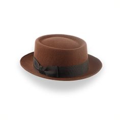 Description Materials Craftsmanship Hat Care Shipping Returns Product Description A Classic Brown Porkpie Fedora Step into timeless elegance with the Antico, a brown porkpie fedora hat handcrafted from fine European wool felt. Offering a sophisticated blend of classic design and modern flair, this hat is perfect for any occasion. With customizable options for a personalized fit, the Antico ensures both comfort and individuality. The genuine leather sweatband and viscose satin lining provide a lu Mens Felt Hats, Spanish Hat, Porkpie Hat, 1940 Style, Homburg, Personalized Hats, Big Hat, Classic Hats, Unique Fits