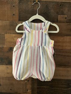 "Adorable, comfortable, and soft baby romper for your precious little love!  Made of 100% bubble gauze cotton, it is washable and durable for hours of baby fun.  The soft elastic leg gently wraps around the baby's upper thigh. Soft plastic snaps located on the inseam and straps make for easy changes.  (Not designed for sleepwear) Rompers are made of 100% cotton (unless otherwise indicated) and are machine washable in warm water. Fabrics were all washed and preshrunk prior to assembly but I would Spring Cotton Bubble Romper For Playtime, Playful Cotton Jumpsuits And Rompers For Playtime, Pink Cotton Bubble Romper For Playtime, Playful Cotton Onesie For Playdate, Pink Cotton Bubble Romper For Playdate, Playful Summer Bubble Romper For Bedtime, Cotton Cute Bubble Romper For Playtime, Cute Cotton Bubble Romper For Playtime, Cute Cotton Bubble Romper For Playwear