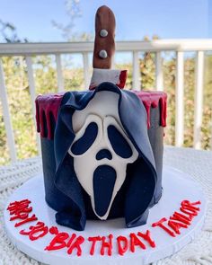 a birthday cake with a knife sticking out of it