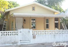 a house with a white picket fence in front of it