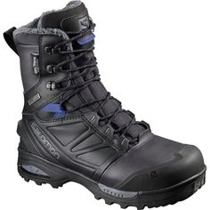 a pair of black snow boots with blue accents on the side and grey soles