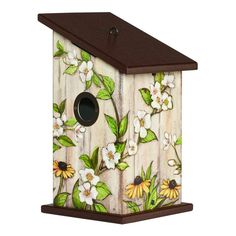 a bird house with flowers painted on it