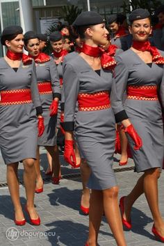 the women are dressed in grey and red