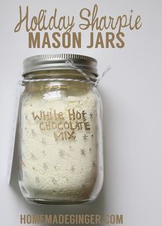 a mason jar with white chocolate mix in it and the words holiday sharpie mason jars