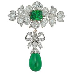 A Victorian diamond and green-paste brooch, the brooch in the form of a flower with a cushion-shaped green paste to the centre surrounded by six petals set with old European-cut diamonds, within diamond-set foliate decorations, suspending a detachable drop consisting of an old-European-cut diamond-set bow suspending a green-paste drop with rose-cut diamond-set cap, the diamonds estimated to weigh 9 carats in total, all mounted and set in silver and gold, with gold brooch fitting, circa 1880, measuring 6.7 x 5.4cm, gross weight 22.3 grams. Victorian brooch is in excellent condition. Unmarked tested as 18ct Gold and Silver. A striking, early 19th century diamond corsage ornament enriched with green paste, from the collection of Bentley & Skinner, the London jewellers by appointment to both H Elegant Pendant, Gold Brooches, Bespoke Jewellery, European Cut Diamonds, Vintage Jewels, High Jewelry, 925 Sterling Silver Jewelry, A Flower, Bentley