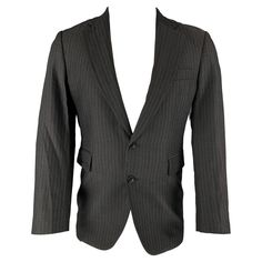 CoSTUME NATIONAL sport coat comes in a black stripped wool blend woven material featuring a notch lapel, flap pockets, and a double button closure. Made in Italy.Excellent Pre- Owned Material. Marked: 38 Measurements: Shoulder: 16.5 inches Chest: 38 inches Sleeve: 24 inches Length: 30 inches Reference: 126094 Category: Sport Coat More Details Brand: CoSTUME NATIONAL Size: 38 Chest Size: 38 Gender: Male Color: Black Pattern: Stripe Fabric: Wool Blend Style: Notch Lapel Age Group: Adult Elegant Striped Outerwear With Pockets, Striped Lapel Collar Outerwear With Double Button, Striped Lapel Collar Outerwear With Double Button Closure, Striped Blazer With Double Button Closure And Notch Lapel, Striped Notch Lapel Blazer With Double Button Closure, Pinstripe Outerwear With Suit Collar For Office, Formal Pinstripe Outerwear With Pockets, Single Breasted Striped Outerwear For Fall, Striped Outerwear With Double Button Closure For Office