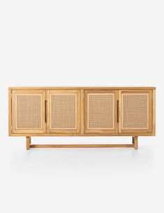 the sideboard is made out of wood and has wicker panels on each side