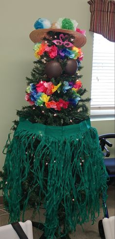 a small christmas tree decorated with colorful decorations