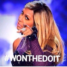 a woman with long blonde hair is holding her hand up to her face and has the words wonthedott on it