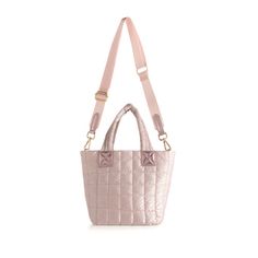 The Shiraleah Logan Mini Tote Cross-Body in rose is the perfect mix of style and functionality. Made with durable nylon and accented with gold hardware, it features double handles and a detachable, adjustable cross-body strap for versatile wear. The top zip closure and inner pockets provide secure storage for your essentials. Versatile Pink Nylon Shoulder Bag, Pink Nylon Shoulder Bag With Detachable Strap, Pink Nylon Bag With Detachable Strap, Chic Pink Nylon Bag, Pink Nylon Shoulder Bag With Adjustable Strap, Rose Gold Bags For Everyday Use, Mini Tote, Gold Hardware, Cross Body