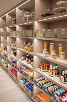 a store filled with lots of shelves full of food and condiments on top of them