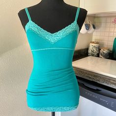 Y2k Nwt Hollister Lace Tank Top. Color Is More Of A Sea Foam Green/Teal But Comes Off More Blue In Photos For Some Reason. Size Xs. Perfect Condition. Green Shirt Y2k, Fitted Camisole Tops For Loungewear, Blue Fitted Tank Top For Loungewear, Green Casual Tops With Built-in Bra, Casual Green Top With Built-in Bra, Casual Green Tops With Built-in Bra, Green V-neck Top With Built-in Bra, Blue Top With Built-in Bra For Loungewear, Blue Cotton Top With Built-in Bra