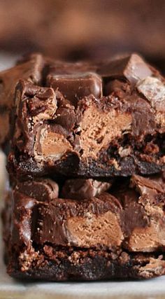 three chocolate brownies stacked on top of each other