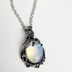 Dare to be bold with this Retro Moonstone Necklace! This statement piece glimmers with daring style, and will be sure to turn heads. Add a touch of glamour to your look and stand out from the crowd! 🤩 🌕 Moon-shaped Clavicle Chain Necklace For Party, Trendy Metal Necklace With Moon Charm, Trendy Moon Charm Necklace For Party, Metal Jewelry With Moon Charm For Party, Mystical Silver Necklace For Party, Silver Moon-shaped Jewelry For Party, Trendy Round Pendant Necklace For Party, Silver Moon Shaped Jewelry For Party, Silver Moon-shaped Party Jewelry