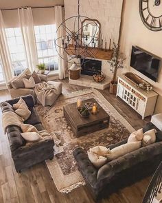 a living room filled with furniture and a large clock mounted to the wall above it