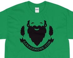 a green t - shirt with the words garagemonk com in black on it