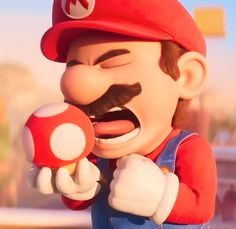 the mario bros character is holding a nintendo wii game controller