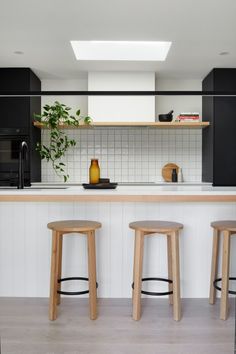 two stools are in front of the counter