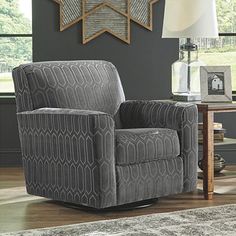 a living room with a gray chair in it