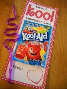 a valentine's day card with a purple toothbrush next to it on a table