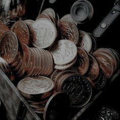 a bunch of coins sitting in a box