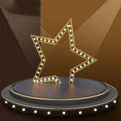 a lighted star on top of a stand with lights around it and a brown background