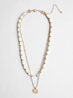 FIT Layer 1: 19” . Layer 2: 21. 5” + 5” extender. . MATERIALS + CARE Base metal and beading. . Imported. DETAILS High shine finish. . Beaded accents. . The best plus size women's layered necklace with beading - gold tone & white necklaces in gold. Torrid is your destination for the freshest spring and summer styles. Adjustable White Beaded Layered Necklace, White Necklaces, Fitted Wedding Dress, Summer Styles, White Necklace, White Image, Layered Necklace, Bra Cups, Boho Necklace