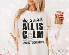 a woman wearing a t - shirt that says, all is calm said no teacher ever