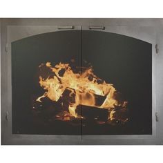 a fire burning inside of a metal oven