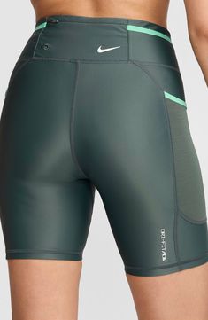 The brand's signature Dri-FIT technology wicks away sweat and keeps you comfortable in these superstretchy bike shorts that move with you from mountain hikes to spin class. Interior drawstring waist Side drop-in pockets; back zip pocket 78% nylon, 22% elastane with 82% polyester, 18% spandex contrast Machine wash, dry flat Imported Nordstrom x Nike: A curated lifestyle destination where fashion is the ultimate sport Fitness Style, Sporty Dress, Spin Class, Green Spring, Running Fashion, Nike Acg, Spandex Shorts, Fashion Board, Spring Green