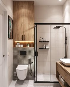 a bathroom with a toilet, sink and shower stall in the corner next to a wooden counter