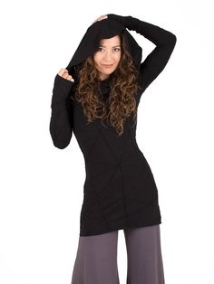 Our signature cowl neck design combined with our innovative texture jersey fabric has been a favorite for years. This slim fit tunic, hugs your curves and comes in 9 colors. The cowl can be worn in multiple ways; as a cozy hoodie, off the shoulders, or draping down your back. We recommend going up a size if you want a looser fit. [#details] Extra long sleeves Thumbholes Size Suggestions S: 2-4 M: 6-8 L: 8-10 XL: 10-12 [/details] [#fabric] Rayon Lycra: 90% Rayon (Viscose) / 10% Spandex (Lycra) [/ Winter Stretch Long Sleeve Top With Thumbholes, Black Spring Cowl Neck Tops, Black Cowl Neck Top For Spring, Fitted Hooded Top For Layering, Hooded Tops With Thumbholes For Fall, Fitted Tunic, Cowl Neck Tunic, Extra Long Sleeves, Cozy Hoodie