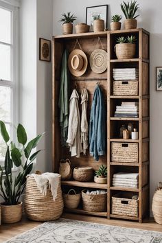 a wooden shelf filled with lots of baskets next to potted plants and other items