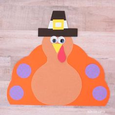 a paper turkey wearing a pilgrim hat