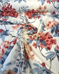 the fabric has red and blue flowers on it