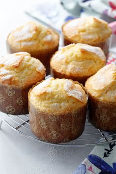 several muffins are sitting on a wire rack