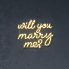 a neon sign that says will you marry me?