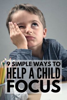 a young boy sitting at a desk with his hand on his face and the words 9 simple ways to help a child focus