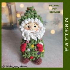 a crocheted christmas decoration with a santa clause on it's head and beard