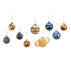 an assortment of christmas ornaments in different colors and sizes, hanging from strings on a white background