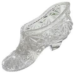 a clear glass shoe is shown on a white background