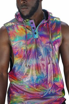 See the world in techno color 😎. The holographic and reflective fabrics in this mens rave tank top will bring your wardrobe to life like you have never experienced before. FEATURES: Hood with drawstring Button down collar Relaxed fit with low arm holes Holographic on the hood and body as well as panels of our signature Photobomber reflective fabric on the back and shoulders Limited edition, once it sells out it's gone forever Ethically made, 100% carbon neutral SIZING: XS - 32 - Chest: 91cm/ 36 Rave Outfit Men, Holographic Top, Dubai Festival, Coachella Style, Rave Shirts, Festival Outfits Men, Reflective Fabric, Rave Fits, Mens Beach