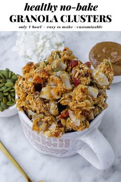 granola clusters in a white bowl on a marble countertop with text overlay that reads healthy no - bake granola clusters only 4 ingredients