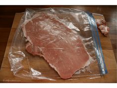 a piece of meat is wrapped in plastic