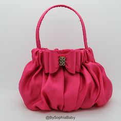 "BABY HOT PINK BOW HANDBAG - Unique Handcraft Bow placed on a fabric Handbag. - Purse Dimension : approx. 6\"W x 6\"H ( not counting with handles) - Please see picture #2 for proportion, baby model is 2 years old. - We make it in many colors, to see the colors available please type \"687\" in our shop browser and the colors will show up. Thank you for visiting our shop, please contact me if you have any question." Hot Pink Purse, Baby Purse, Toddler Purse, Lady Dior Handbag, Expensive Bag, Luxury Bags Collection, Purse Pink, Fabric Handbags, Baby Bow Headband