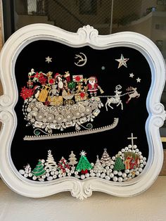 a black and white frame with santa's sleigh on it