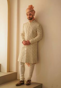 Editor's Note Ivory Sherwani With Jaal Hand Embroidery, Paired With Old Rose Ombre Stole, Ivory Kurta And Churidar Fabric: Linen Silk Color: Ivory Component: Sherwani, Kurta, Churidar, Stole, Safa Care: Dry Clean Only About the Designer After establishing himself as the leading couturier in the industry of menswear, Jatin Malik went on to explore luxury footwear. You can order online these amazingly designed handmade shoes that are being offered in classy Caligae and Peshawari patterns! We recog Beige Sherwani With Resham Embroidery, Beige Sherwani With Resham Embroidery For Transitional Season, Off-white Zari Work Straight Kurta Set, Cream Embroidered Sets With Traditional Drape, Fitted Beige Fabric With Resham Embroidery, Fitted Beige Embroidered Fabric With Resham Embroidery, Traditional Off White Sherwani With Intricate Embroidery, Cream Straight Kurta Set For Wedding, Traditional Off-white Sherwani With Intricate Embroidery