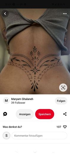 the back of a woman's stomach with an intricate design on her lower side