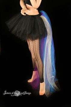 "Handmade from 25yards, two layers of soft smooth Black Bridal tulle, that has been gathered and serged to the black fabric covered elastic waistband, the back bustle(attached) is made from two layers of long bridal tulle in gold, royal, turquoise, purple, teal. It is around 50\" long and will trail behind you! This skirt is not made yet, It is made when ordered! Measurement: Sizes go by (in inches) smallest waist size tutu will fit, to largest Hips tutu fits over XSmall 24\"-34\" Small 26\"-38\ Halloween Costume Petticoat With Attached Cancan, Halloween Costume Petticoat With Cancan, Stretch Ballet Petticoat For Party, Fitted Tutu Dress For Carnival Costume Party, Fitted Tutu Dress For Costume Party And Carnival, Carnival Costume Party Fitted Tutu Dress, Gothic Petticoat For Halloween Party, Gothic Halloween Party Petticoat, Halloween Stretch Tulle Petticoat